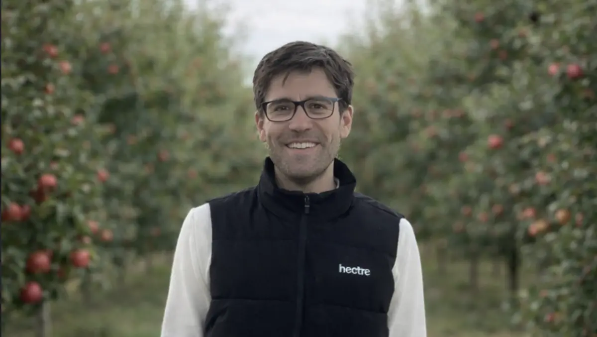 A Hectre team member among the apple trees